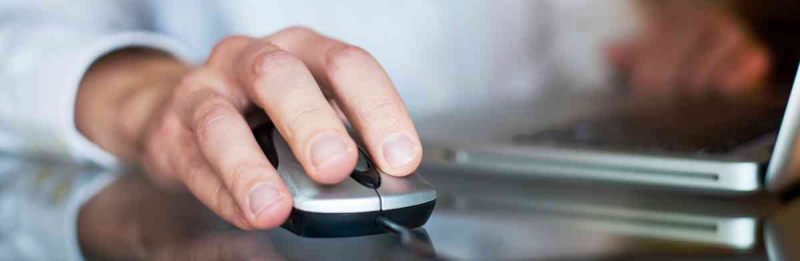 Man clicking on a mouse.
