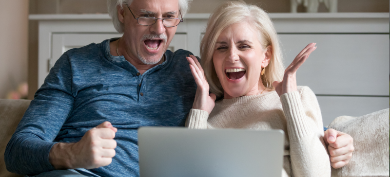 Older couple excited about online auction