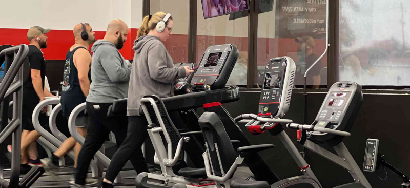 General fitness concept with members running on treadmills.